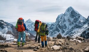 Trekkers with backpacks on the trail to Everest Base Camp in the Khumbu valley