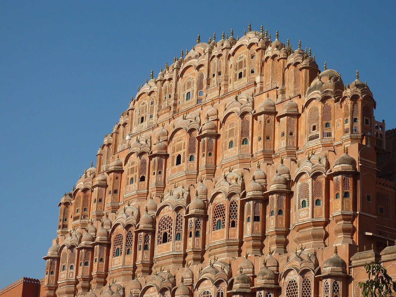 The pink sandstone façade of Hawa Mahal, the Palace of Winds, in Jaipur's old city