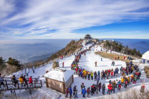 Visitors on the snow at a hill-station viewpoint near Shimla, Himachal Pradesh