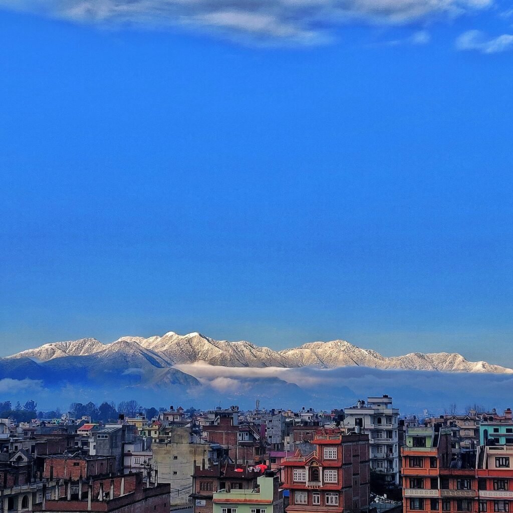 Snow-capped Himalayan mountains overlooking Kathmandu Valley cityscape in Nepal