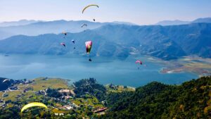 Soar above Pokhara's stunning Phewa Lake—one of the world's best paragliding destinations.