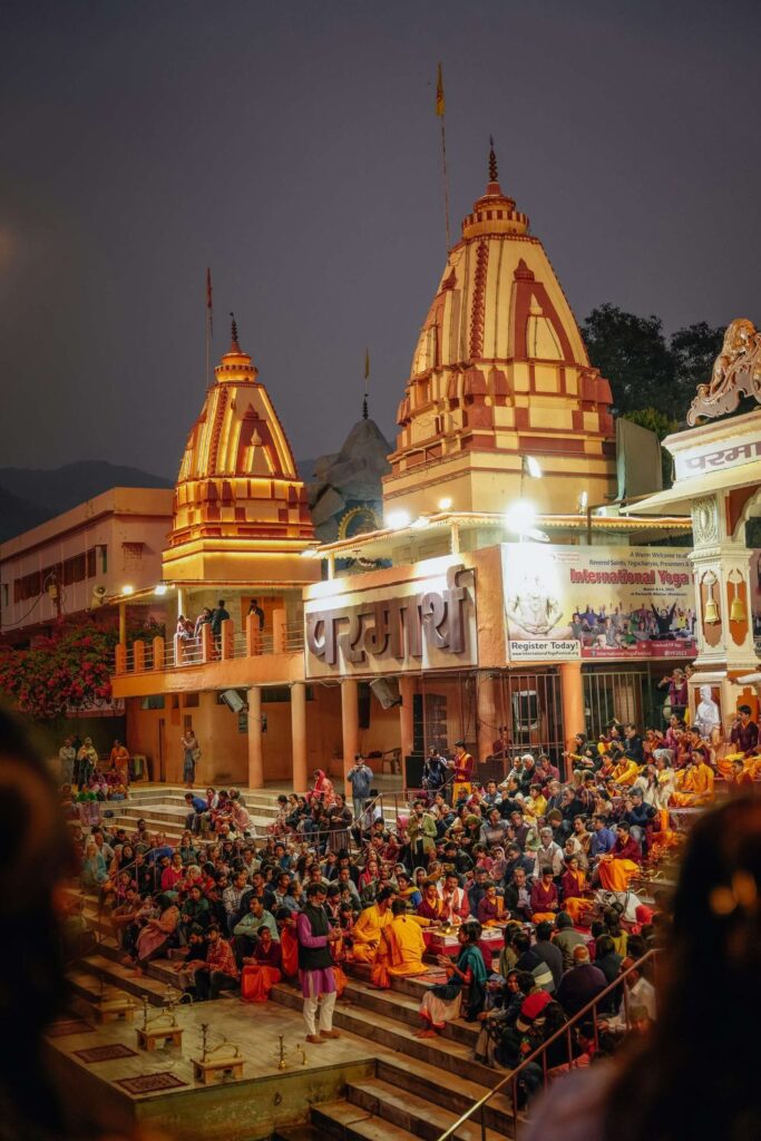 Evening Ganga aarti with crowds on the ghats at Rishikesh
