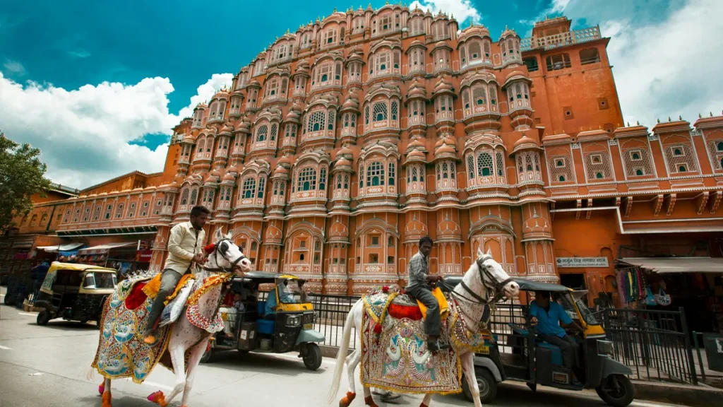 Pink sandstone facade of Hawa Mahal in Jaipur on a golden triangle tour