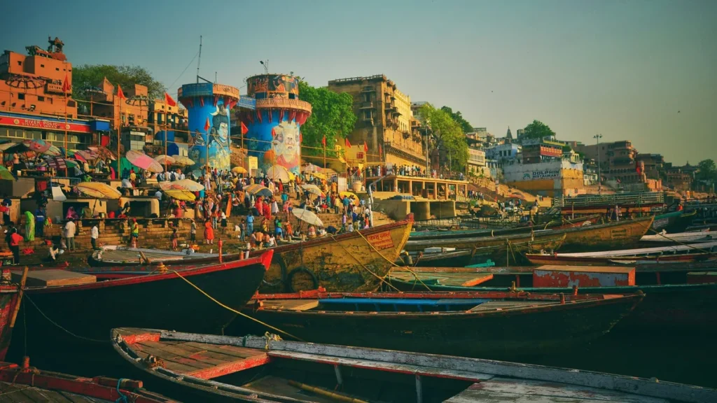 Wooden boats on the Ganga in front of the ghats of Varanasi at dawn