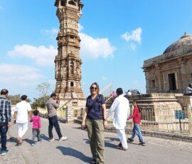 Exploring the historic Kirti Stambh at Chittorgarh Fort — a UNESCO World Heritage Site in Rajasthan. Tourist visiting Kirti Stambh Tower of Fame at Chittorgarh Fort in Rajasthan, India