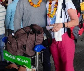 A warm welcome to India—our travelers receive their marigold garlands right at Delhi airport arrivals. Couple receiving traditional marigold garland welcome at Delhi airport arrival on India tour